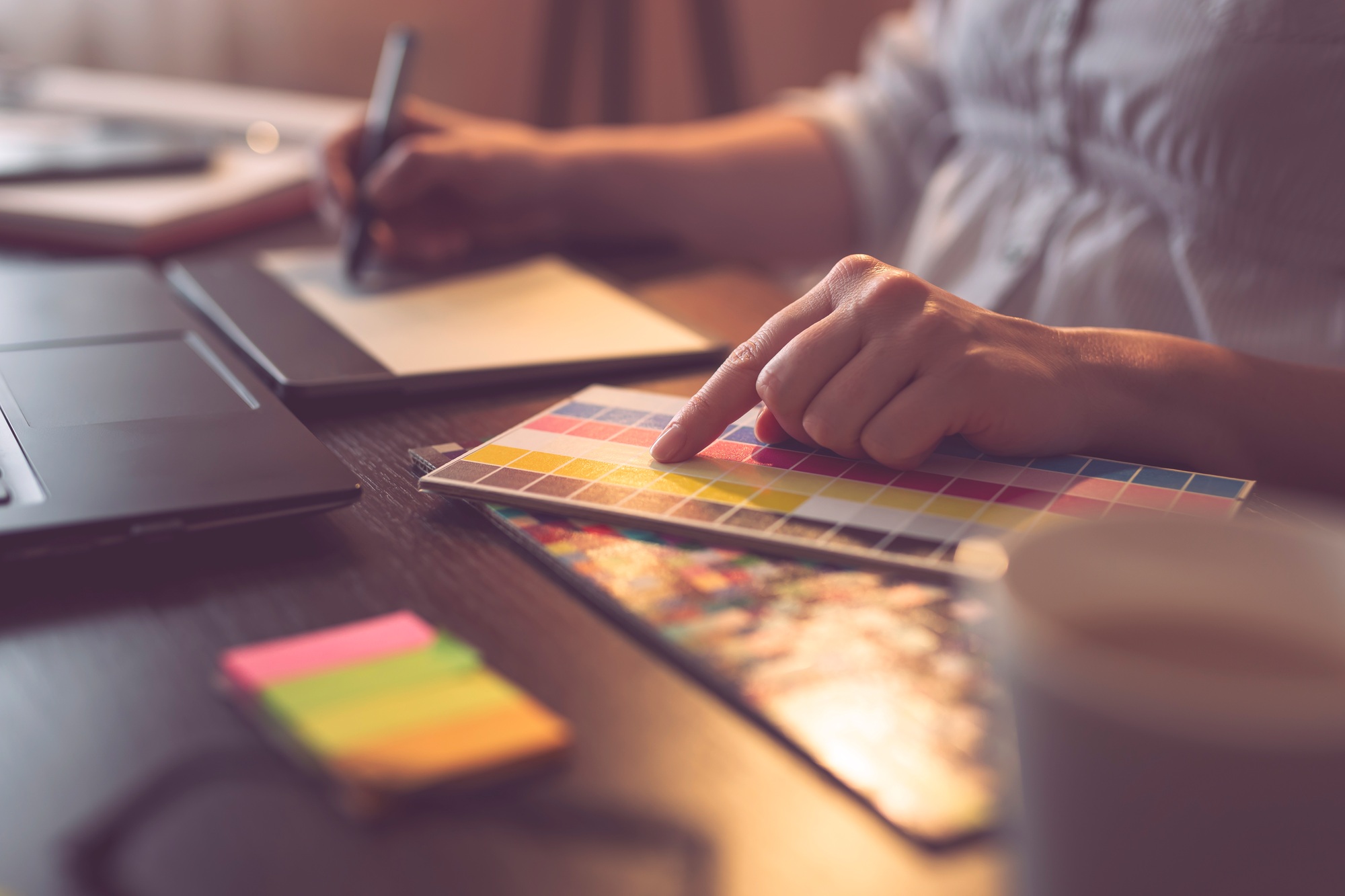 Graphic designer choosing a color from a color palette